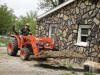 Haul away debris to waiting trailer that hauls to brush pile.